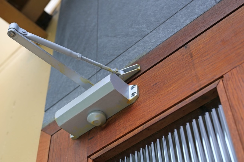 closeup door closer entrance door
